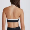 Αθλητικό σουτιέν Soft Active Twist-Front με λαιμόκοψη σε μαύρο Αθλητικό σουτιέν Soft Active Twist-Front με λαιμόκοψη σε μαύρο