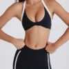 Αθλητικό σουτιέν Soft Active Twist-Front με λαιμόκοψη σε μαύρο Αθλητικό σουτιέν Soft Active Twist-Front με λαιμόκοψη σε μαύρο