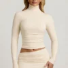 Auri Modal Ruched Backless Turtleneck Μπλούζα σε χρώμα ιβουάρ Auri Modal Ruched Backless Turtleneck Μπλούζα σε χρώμα ιβουάρ