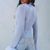 Διαφανή μπλούζα Elisia με φτερά σε απαλό μπλε Διαφανή μπλούζα Elisia με φτερά σε απαλό μπλε