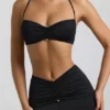 Jerika Slinky Jersey Μπραλέτα με λεπτομέρειες από μεταλλικά στοιχεία και λαιμόκοψη halter σε μαύρο Jerika Slinky Jersey Μπραλέτα με λεπτομέρειες από μεταλλικά στοιχεία και λαιμόκοψη halter σε μαύρο