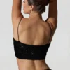 Κοντή μπλούζα Ariana με διακοσμητικά cut-out σε μαύρο χρώμα Κοντή μπλούζα Ariana με διακοσμητικά cut-out σε μαύρο χρώμα