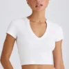 Κοντό T-shirt από ελαστικό βαμβακερό jersey με γραφικό τύπωμα σε λευκό Κοντό T-shirt από ελαστικό βαμβακερό jersey με γραφικό τύπωμα σε λευκό