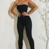 Μαύρη ολόσωμη φόρμα Jamila με στράπλες και φαρδιά ποδιά Μαύρη ολόσωμη φόρμα Jamila με στράπλες και φαρδιά ποδιά