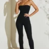 Μαύρη ολόσωμη φόρμα Jamila με στράπλες και φαρδιά ποδιά Μαύρη ολόσωμη φόρμα Jamila με στράπλες και φαρδιά ποδιά