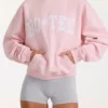 Oversized φούτερ με κουκούλα και απλικέ σε ροζ χρώμα Oversized φούτερ με κουκούλα και απλικέ σε ροζ χρώμα